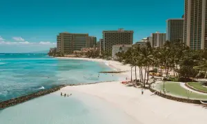 Waikiki Beach on a sunny day with hotels near the shore